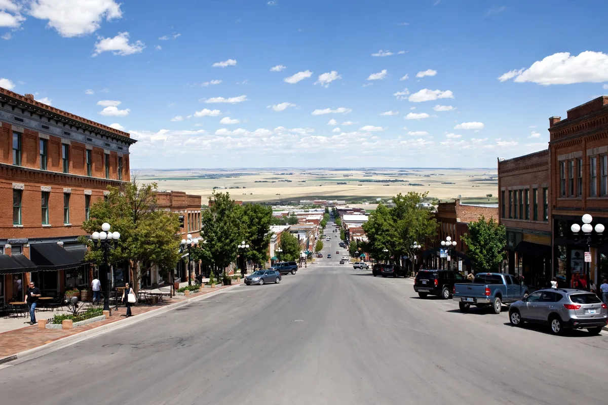 Historic brick downtown street in Greeley with open plains beyond the city